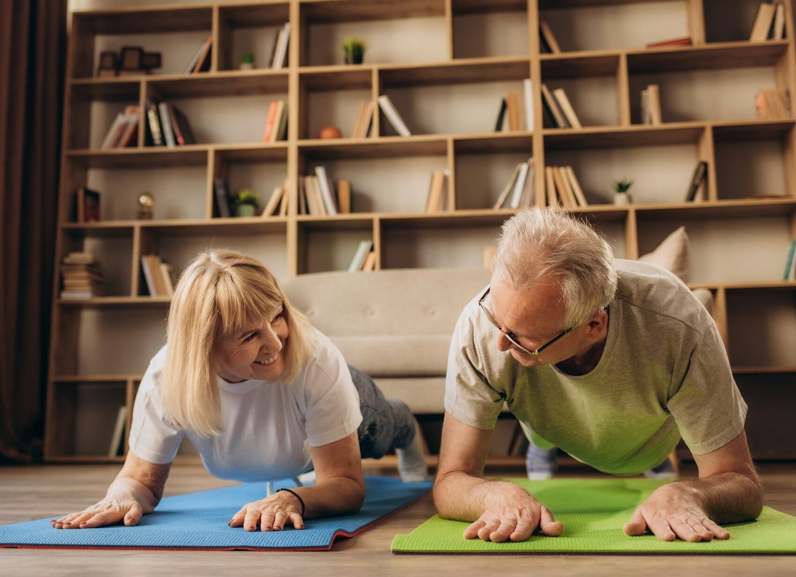 Portrait of a Senior Couple Doing Gymnastics and Yoga Stretching Exercises Together at Home on Sunny